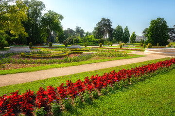 Plakat Beautiful garden of Festetics Palace with flowers and green grass and trees on a sunny summer day, Keszthely, Zala, Hungary. Outdoor travel background