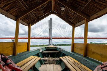 Amazon Green Rainforest Riverbank. Traditional local fishing boats, view from inside. Amazon...