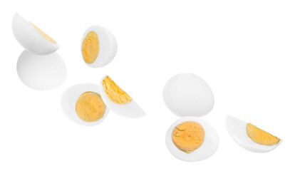 Tasty hard boiled eggs falling on white background