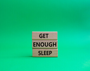 Get enough sleep symbol. Wooden blocks with words Get enough sleep. Beautiful green background. Healthy lifestyle, medical and Get enough sleep concept. Copy space.