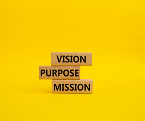Vision Purpose Mission symbol. Concept word Vision Purpose Mission on wooden blocks. Beautiful yellow background. Business and Vision Purpose Mission concept. Copy space.