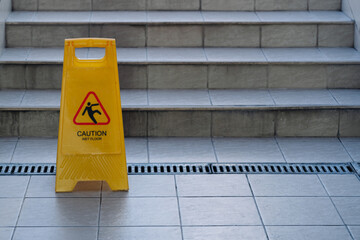 Sign showing warning of caution wet floor.