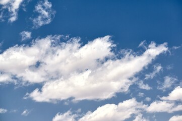 Beautiful white clouds on a deep blue sky on a summer day