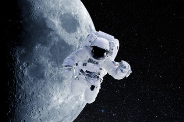 Astronaut in outer space on a background of moon. National Moon Day. Conceptual image. Elements of...