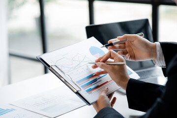 Atmosphere of a startup company meeting, business people are meeting together to summarize and plan investment finances, they are the founders of the company. Business administration concept.