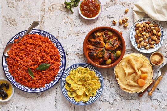 Jollof Rice. Potato Bhaja. Chicken Curry. Traditional African dishes. Flat layot