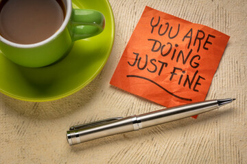 you are doing just fine reminder note, positive affirmation on a sticky note with coffee