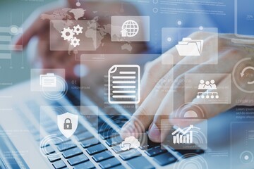 document management concept with icons on virtual screen, Businessman working on the computer for document management concept, online documentation database, and digital file storage system.