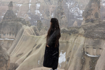 girl looking at fairy chimneys