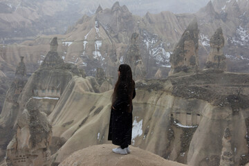 girl looking at fairy chimneys