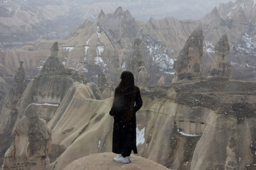 girl looking at fairy chimneys