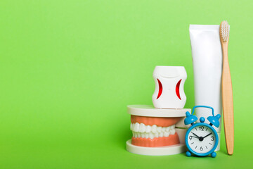 Mouthwash and other oral hygiene products on colored table top view with copy space. Flat lay. Dental hygiene. Oral care kit. Dentist concept