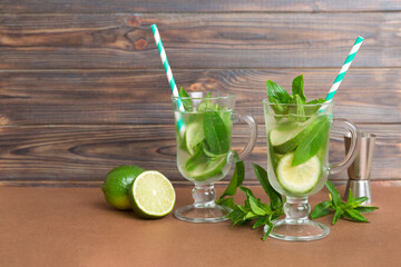 Mojito cocktail. Refreshing mojito cocktail with lime, lemon and mint in a tall glass with a stick