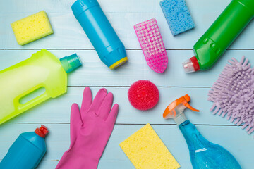 Many different house cleaning products on wooden background, top view