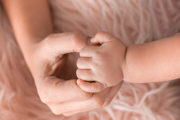 portrait of newborn in the garden, parents with baby, newborn baby