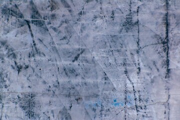 Gray to blue surface, irregularly colored.