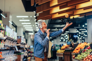 Senior man singing while shopping in grocery