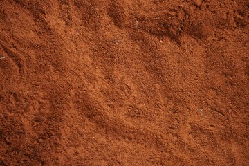 Rot-braune Sandfläche mit Muster