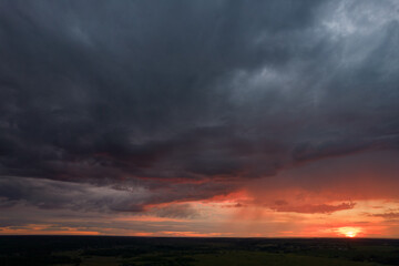 red sunset in storm clouds