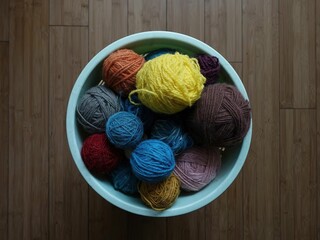 Various colors and textures of wool balls in the basket, top vi