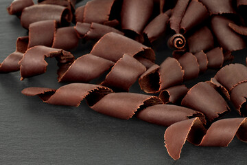 Scattered Chocolate Curls on black background