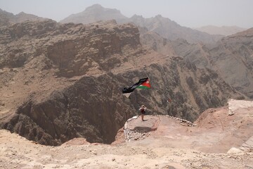 Silhouette of standing lonely woman on viewpoint. Beautiful mountain views on the Jordan Trail from...