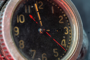 Clock face, close up. Arrows with phosphorescent, fluorescent paint that contains radioactive...