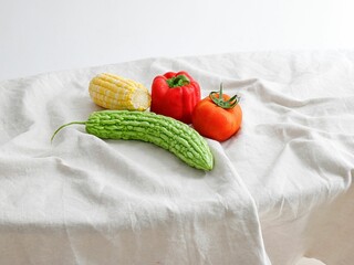 Tomato, pepper, bitter gourd, corn on white background