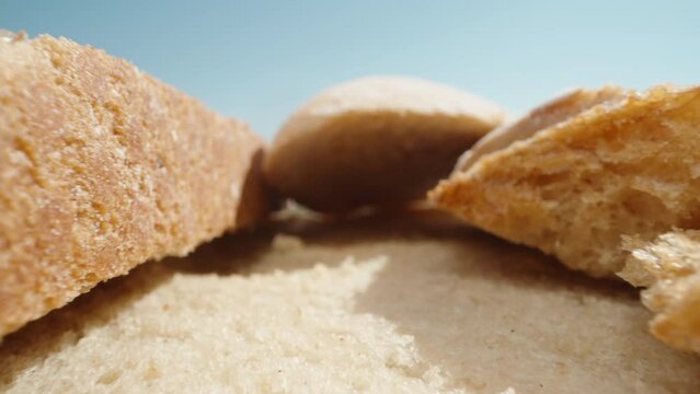 Slices of white bread in the sun. Dolly slider extreme close-up. Laowa Probe