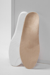 Insoles isolated on a white background. Medical orthopedic insoles. Foot care. Insole cutaway...