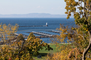 Close-up view of Lake Champlain, its boat docking slips and lighthouse as seen from Burlington,...