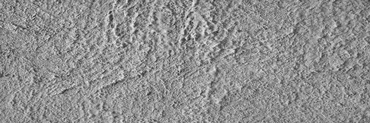 Plaster texture. Stucco gray background. Panorama of a plastered wall. Dry textured cement.