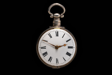 Dial of silver antique pocket watch on isolated black background. Old mechanical clock. Round retro...