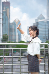 Fototapeta premium smiling woman standing happily in the park