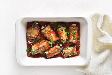Baked eggplant rolls with tomato sauce and cheese