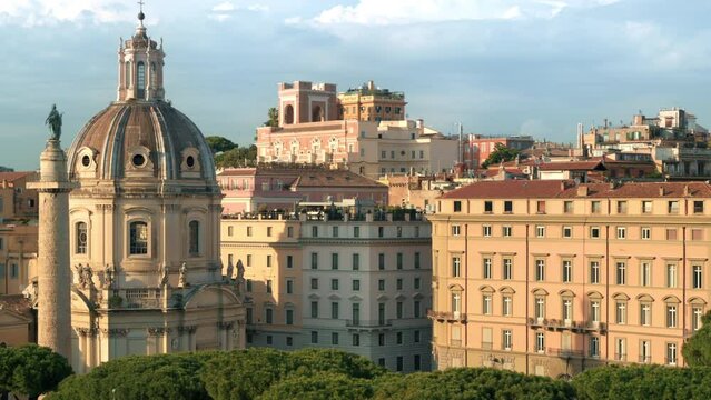 Street scape of the ancient centre of Rome, Italy. Santa Maria di Loreto and Trajan Column, greenery and old buildings