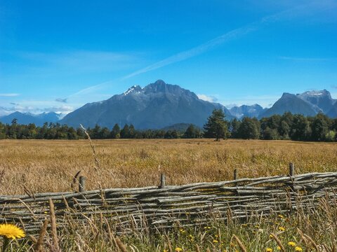 Beautiful landscape of fields with mountains on the background near Palena, Chile