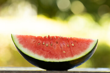 natural watermelon with green outdoor background