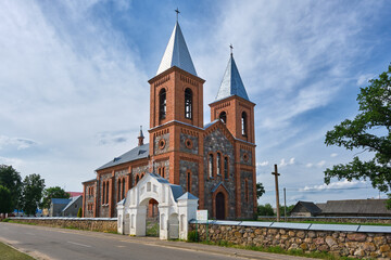 Fototapeta na wymiar Old ancient catholic church of Saints Simeon and Tadeusz in Lazduny, Grodno region, Belarus.