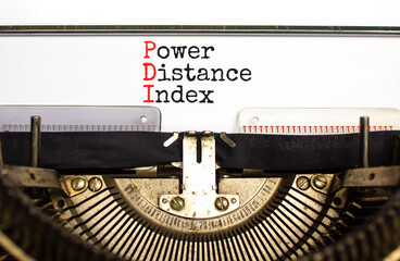 PDI power distance index symbol. Concept words PDI power distance index typed on old retro typewriter on a beautiful white background. Business PDI power distance index concept. Copy space.