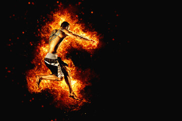 Fototapeta na wymiar Fighter man in fire. Sport advertising. MMA boxer
