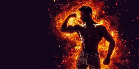 Brutal strong athletic Bodybuilder posing. Fire and spark explosion in the background. 