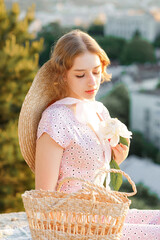 Beautiful girl on the mountain at sunset. Vintage tone. Stylish girl posing on a background of the...