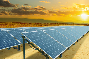 Photovoltaic traps. Solar panels. Photovoltaic panels at sunset. Solar panels mounted on sand....