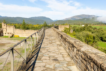 Fototapeta na wymiar green landscape and mountains seen from the castle wall of Aínsa (Aínsa-Sobrarbe), Sobrarbe, province of Huesca, Aragon, Spain