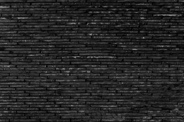 Fototapeta na wymiar Black brick wall. Background of modern interior design.