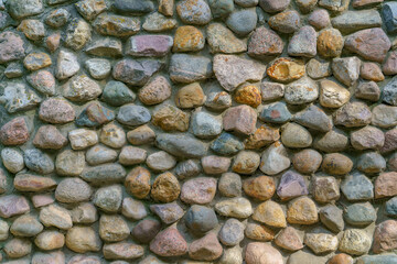 Wall of gray stones. Stone building background.