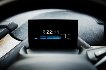 Hour of full charging, remaining time, view on the screen in electric car