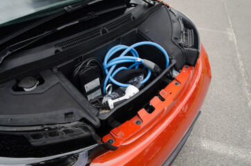 Car trunk for charging cables, front of the car