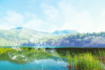 A beautiful lake in a summer green forest.Summer green lake view. Summer forest lake landscape